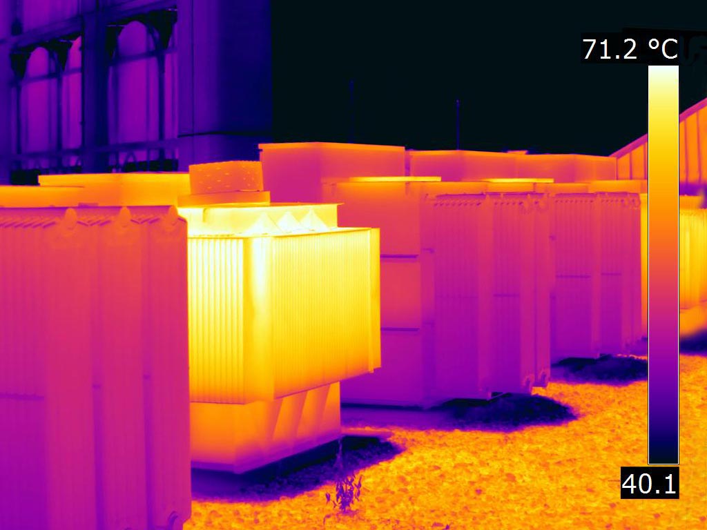 Two mounted transformers under load - FLIR T1K IR Image Two mounted transformers under load - FLIR T1K IR Image